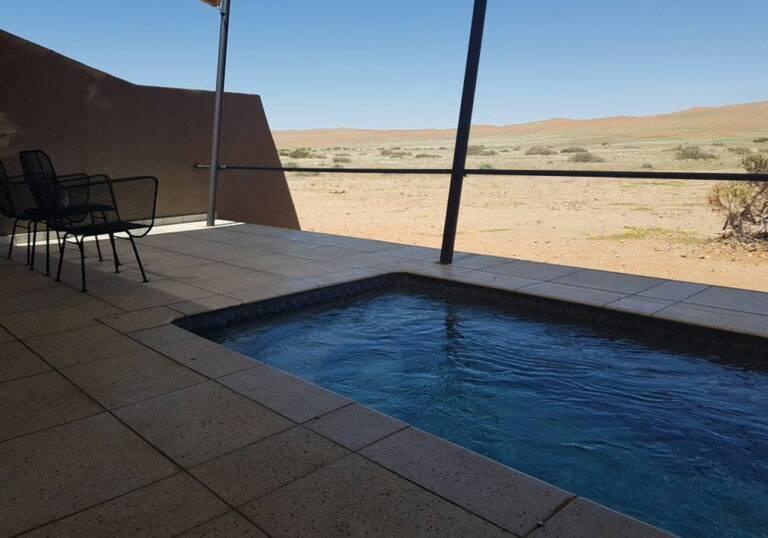 NSPI award-winning pool by Pools For Africa in Cape Town, Western Cape — Dazzling Desert Retreat: Pebble Pools at Desert Grace Solitaire